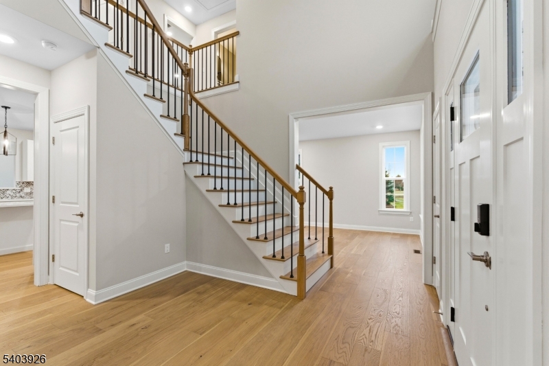 105 Junction Road Hampton, NJ 08827 - Photo 5 of 40 a view of a hallway with wooden floor and staircase