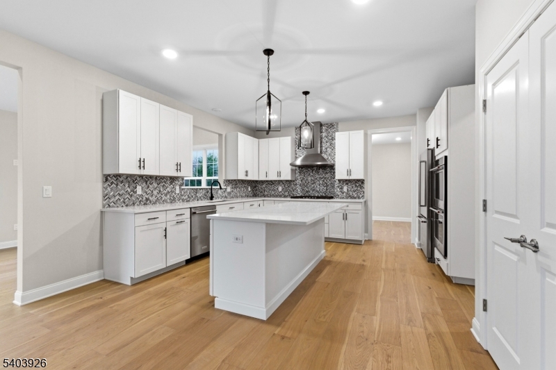 105 Junction Road Hampton, NJ 08827 - Photo 6 of 40 a large kitchen with granite countertop a large counter top a sink stainless steel appliances and cabinets