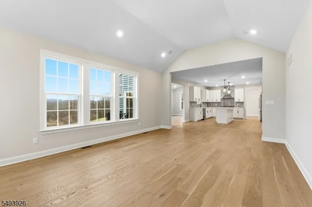 a view of a kitchen with a sink and cabinets