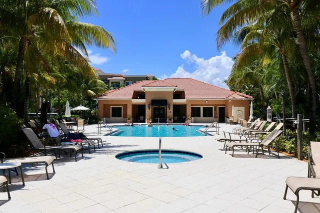 a swimming pool with outdoor seating