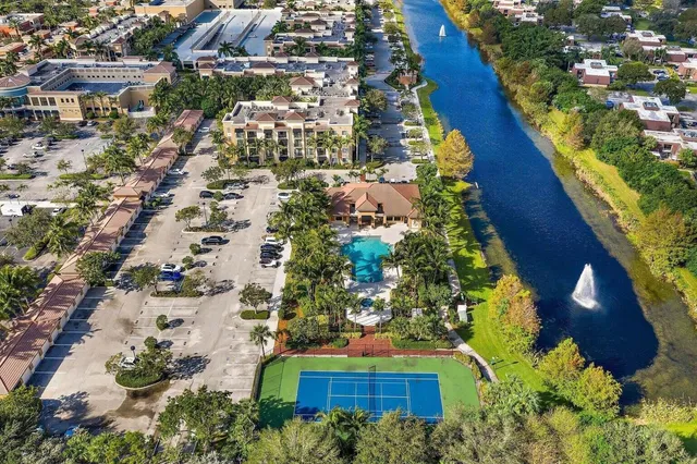 a view of swimming pool with chair and table