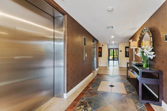 a bathroom with a glass shower door