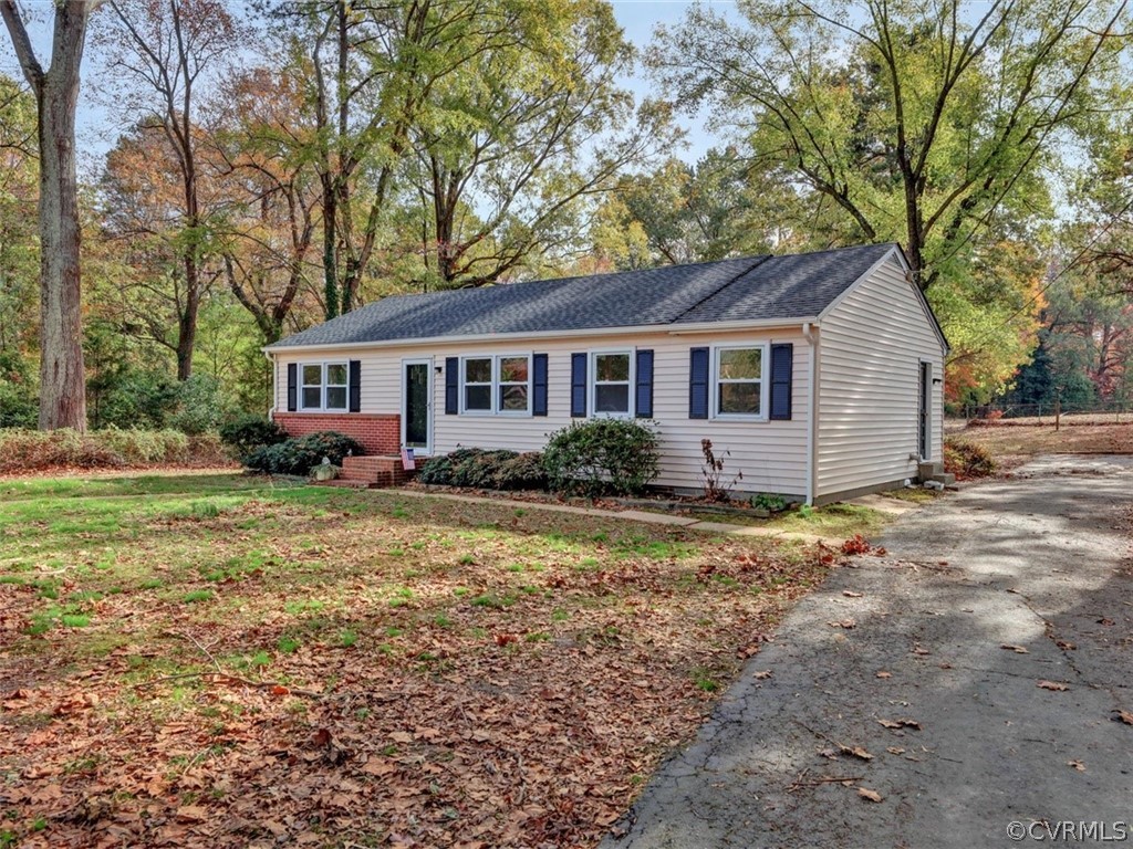 Front elevation with view of driveway.