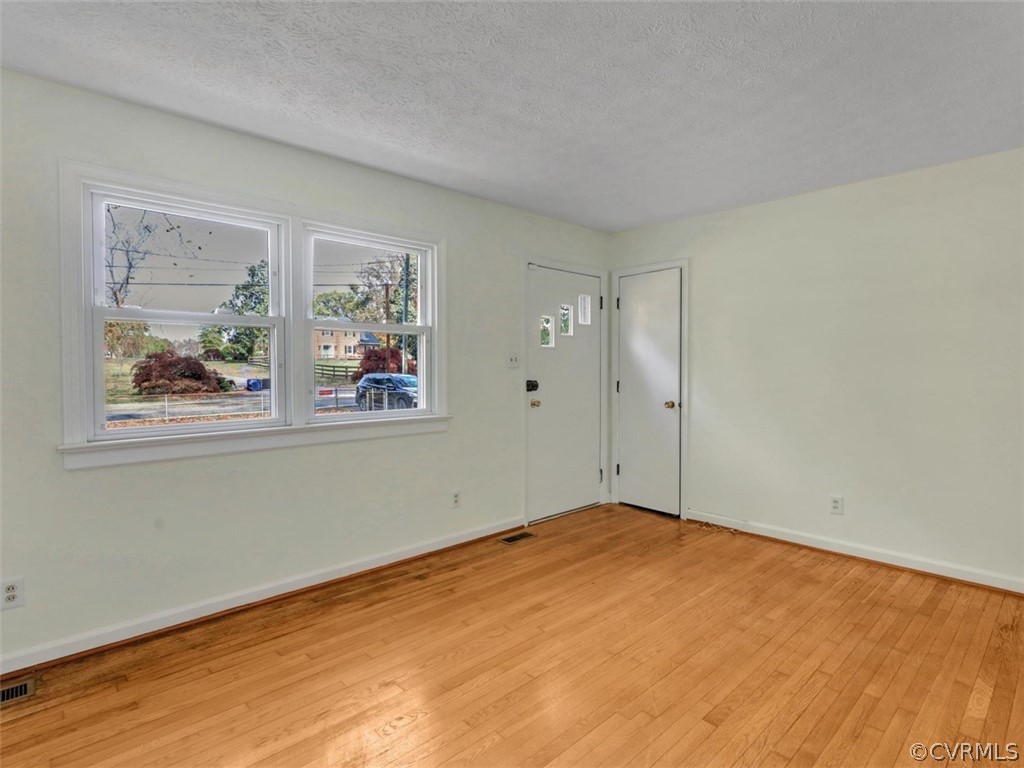 Family Room ~ view of front door and coat closet.
