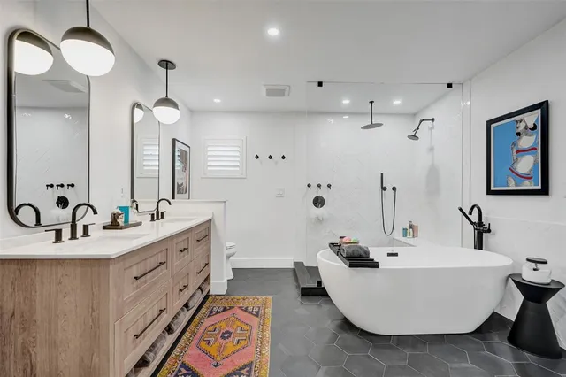 a patio with a table and chairs under an umbrella