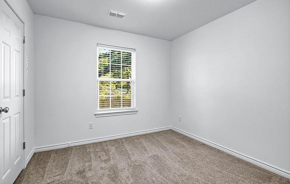406 East Elm Street Denison, TX 75021 - Photo 12 of 21 an empty room with a window