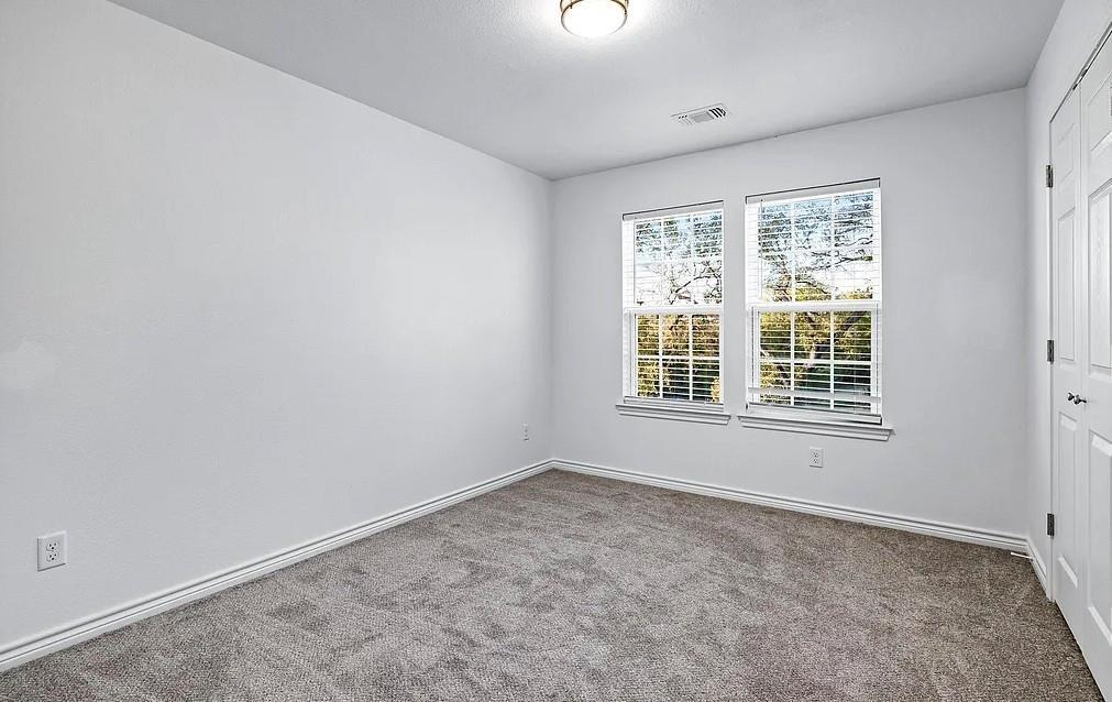 406 East Elm Street Denison, TX 75021 - Photo 14 of 21 an empty room with a window