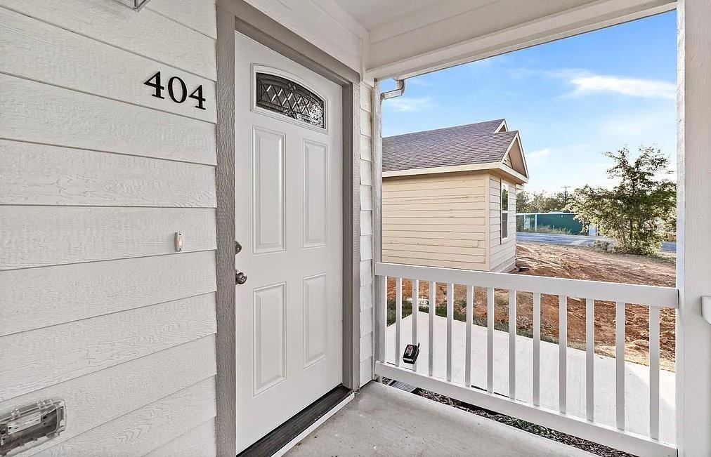 406 East Elm Street Denison, TX 75021 - Photo 18 of 21 a view of a street from a balcony