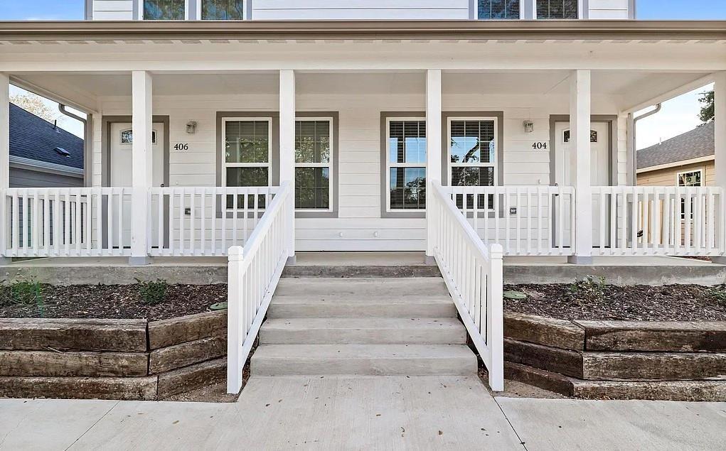 406 East Elm Street Denison, TX 75021 - Photo 4 of 21 a view of a house with a wooden fence