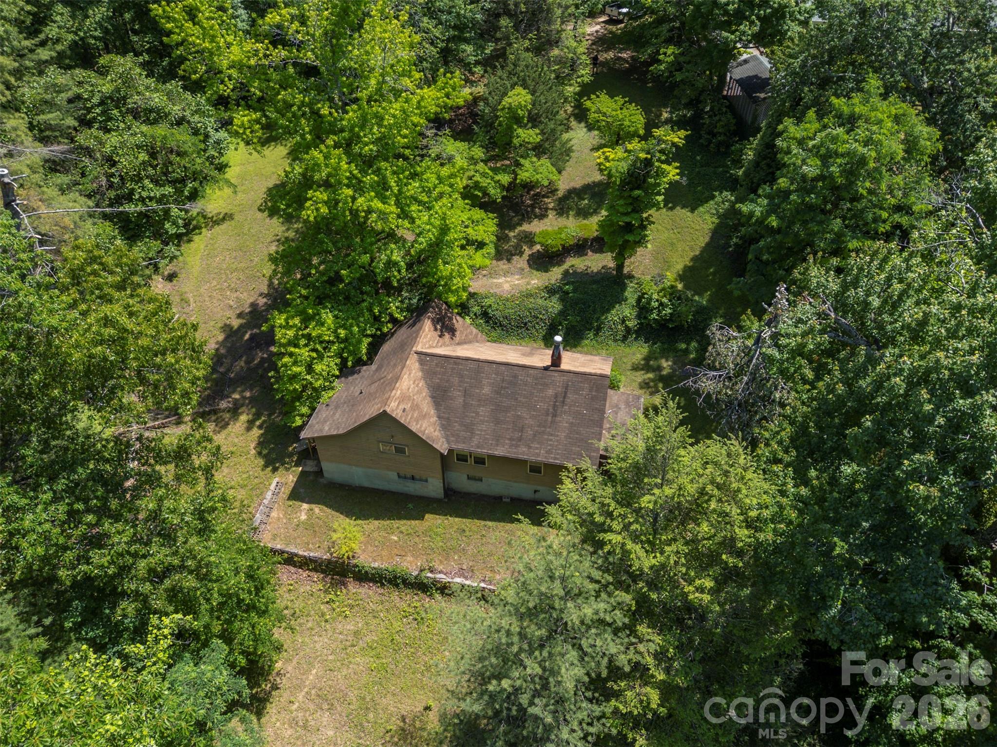 77 1st Street Tryon, NC 28782 - Photo 5 of 20 an aerial view of a house with yard swimming pool and outdoor seating
