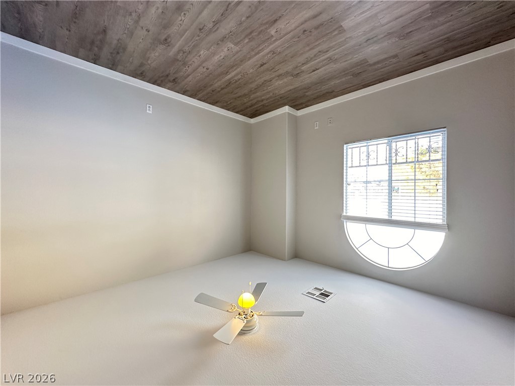 10191 Splendor Ridge Avenue Las Vegas, NV 89135 - Photo 22 of 31 A well-lit room offers comfort and ample space, perfect for quiet relaxation.