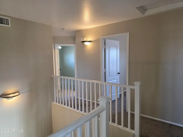 a view of hallway with staircase