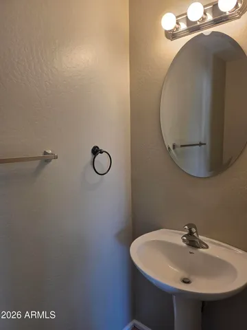 a bathroom with a sink and mirror