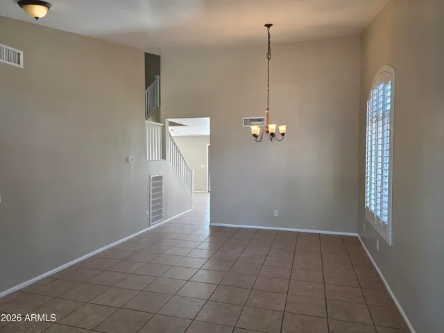 a view of a hallway with stairs