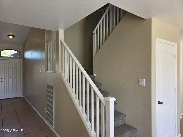 a view of staircase with wooden floor and stairs