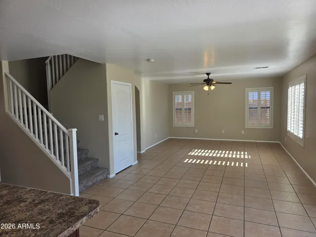 a view of an empty room with windows