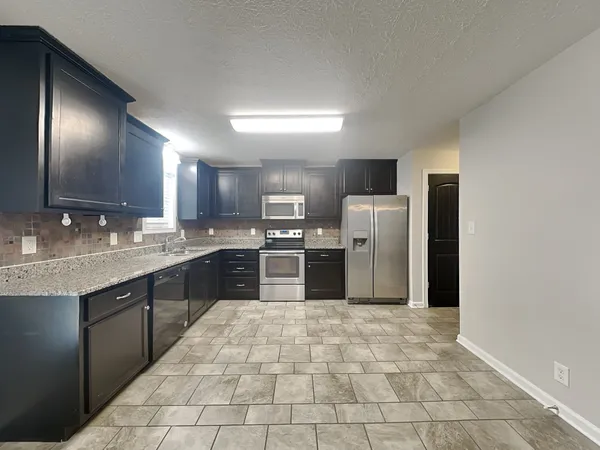 a large kitchen with cabinets