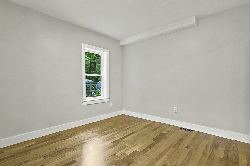 4 Mayhew Street Framingham, MA 01702 - Photo 12 of 42 wooden floor in an empty room with a window