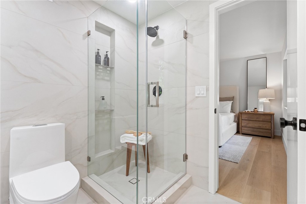 3621 Myrtle Street Irvine, CA 92606 - Photo 29 of 40 a bathroom with a toilet a sink and shower