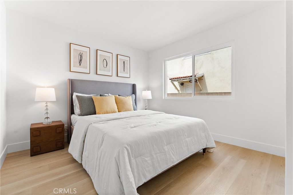 3621 Myrtle Street Irvine, CA 92606 - Photo 30 of 40 a bedroom with a bed and a night stand