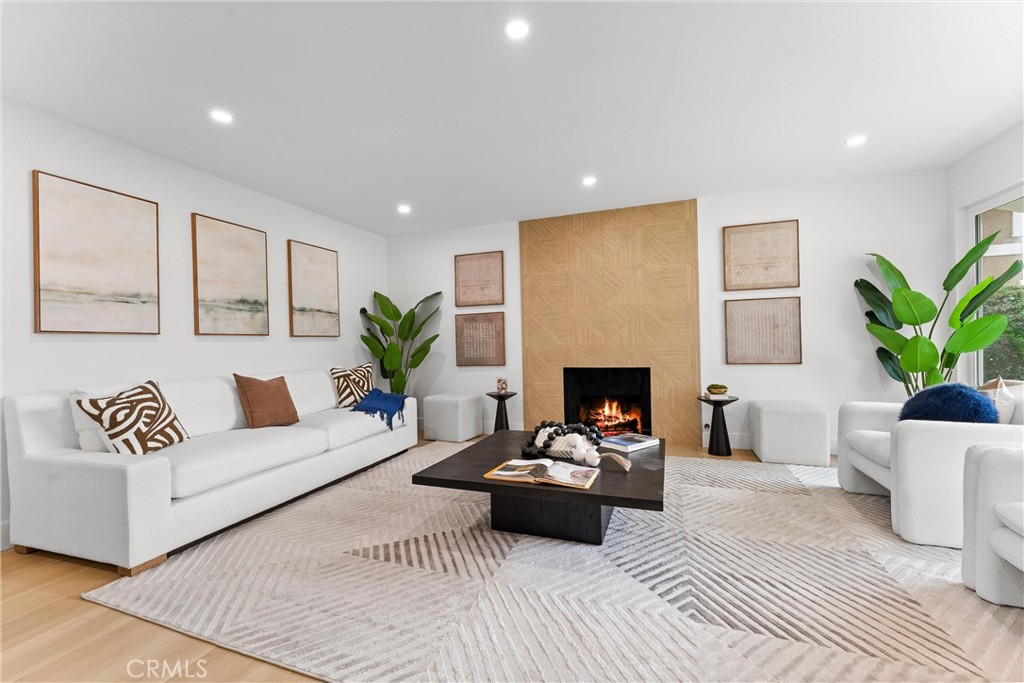 3621 Myrtle Street Irvine, CA 92606 - Photo 6 of 40 a living room with furniture a fireplace and a potted plant