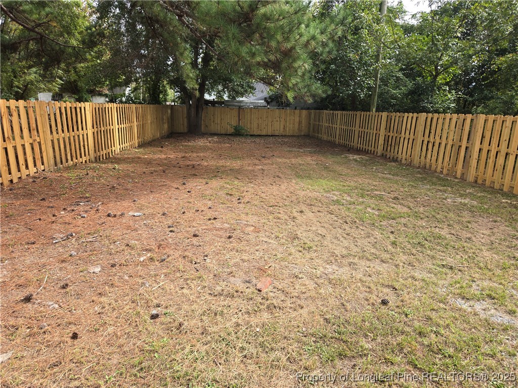 41 Marion Road Lumberton, NC 28358 - Photo 3 of 7 a view of backyard and wooden fence