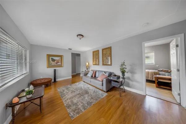 a bedroom with furniture and a window