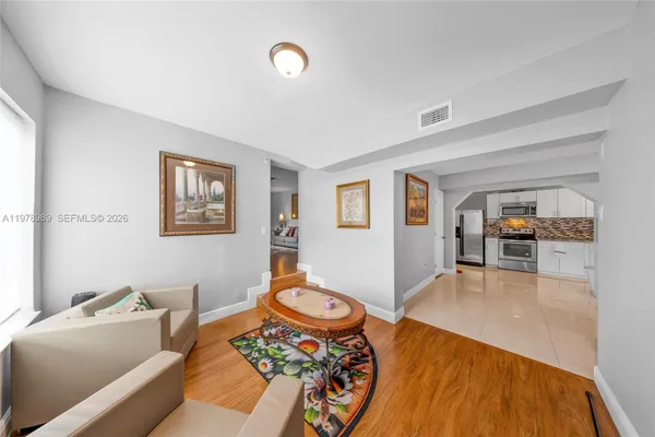 a bedroom with two beds and a window