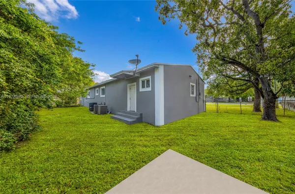 a view of a house with a swimming pool