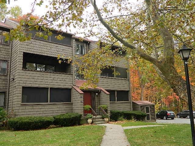 175 Towne House Road, Unit 175 Hamden, CT 06514 - Photo 1 of 1 a view of a house with a yard and a large tree
