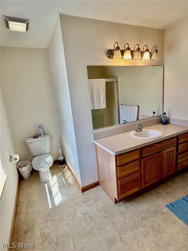 30891 Harrison Road Wickliffe, OH 44092 - Photo 10 of 18 Master Bathroom featuring large vanity, shower and tile floors