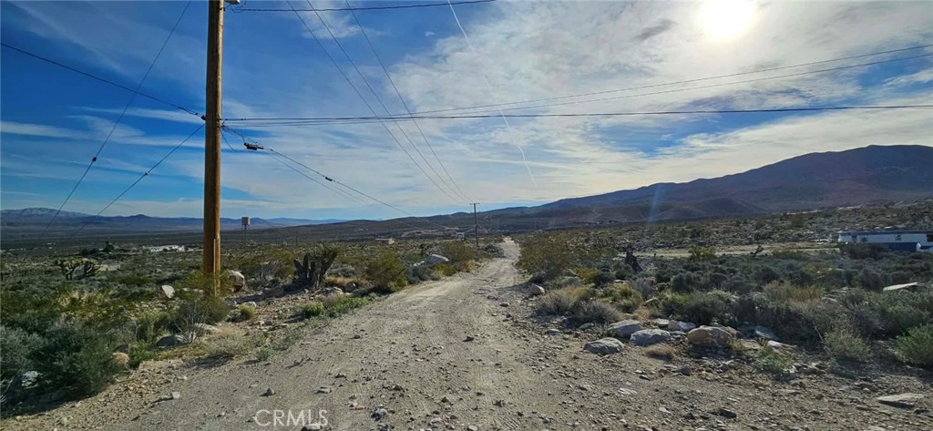 800 Meehleis Road Lucerne Valley, CA 92356 - Photo 6 of 6 a view of a road with an ocean in the background