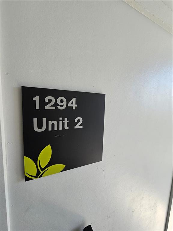 1294 Longreen Terrace Northwest, Unit 2 Atlanta, GA 30318 - Photo 3 of 25 a sign that is on the wall