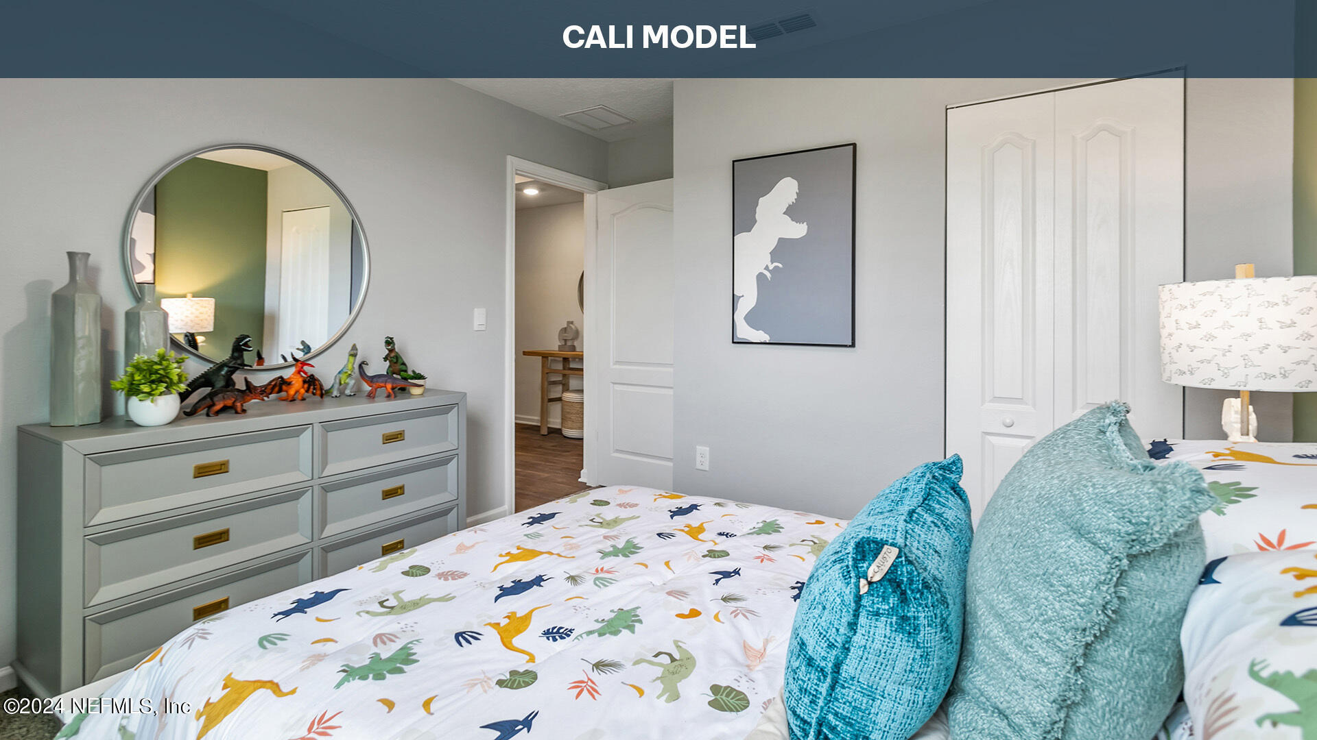 5561 Rustic Thorn Road Jacksonville, FL 32219 - Photo 24 of 63 a bedroom with a bed and a dresser