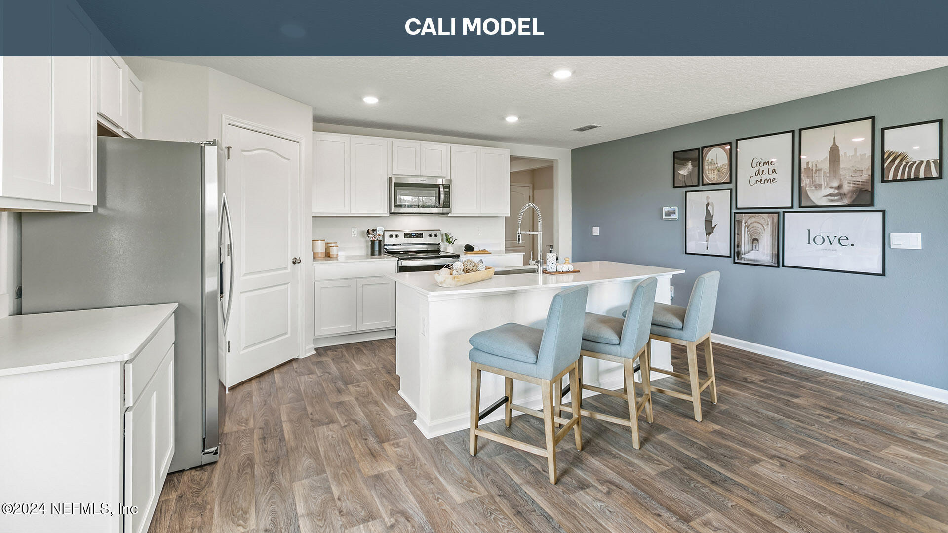 5561 Rustic Thorn Road Jacksonville, FL 32219 - Photo 6 of 63 a kitchen with stainless steel appliances kitchen island granite countertop a refrigerator a stove a dining table and chairs with wooden floor