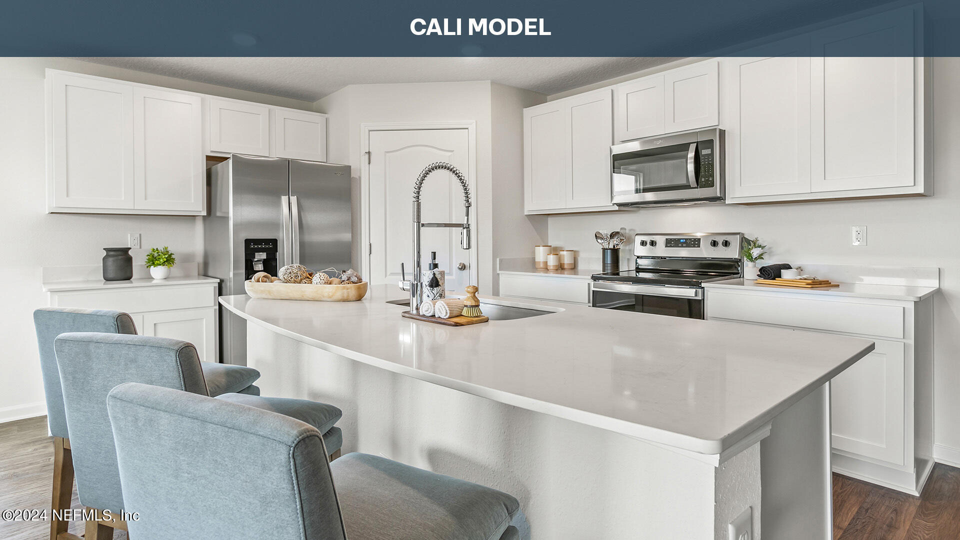 5561 Rustic Thorn Road Jacksonville, FL 32219 - Photo 7 of 63 a kitchen with stainless steel appliances a sink a stove a microwave and wooden cabinets