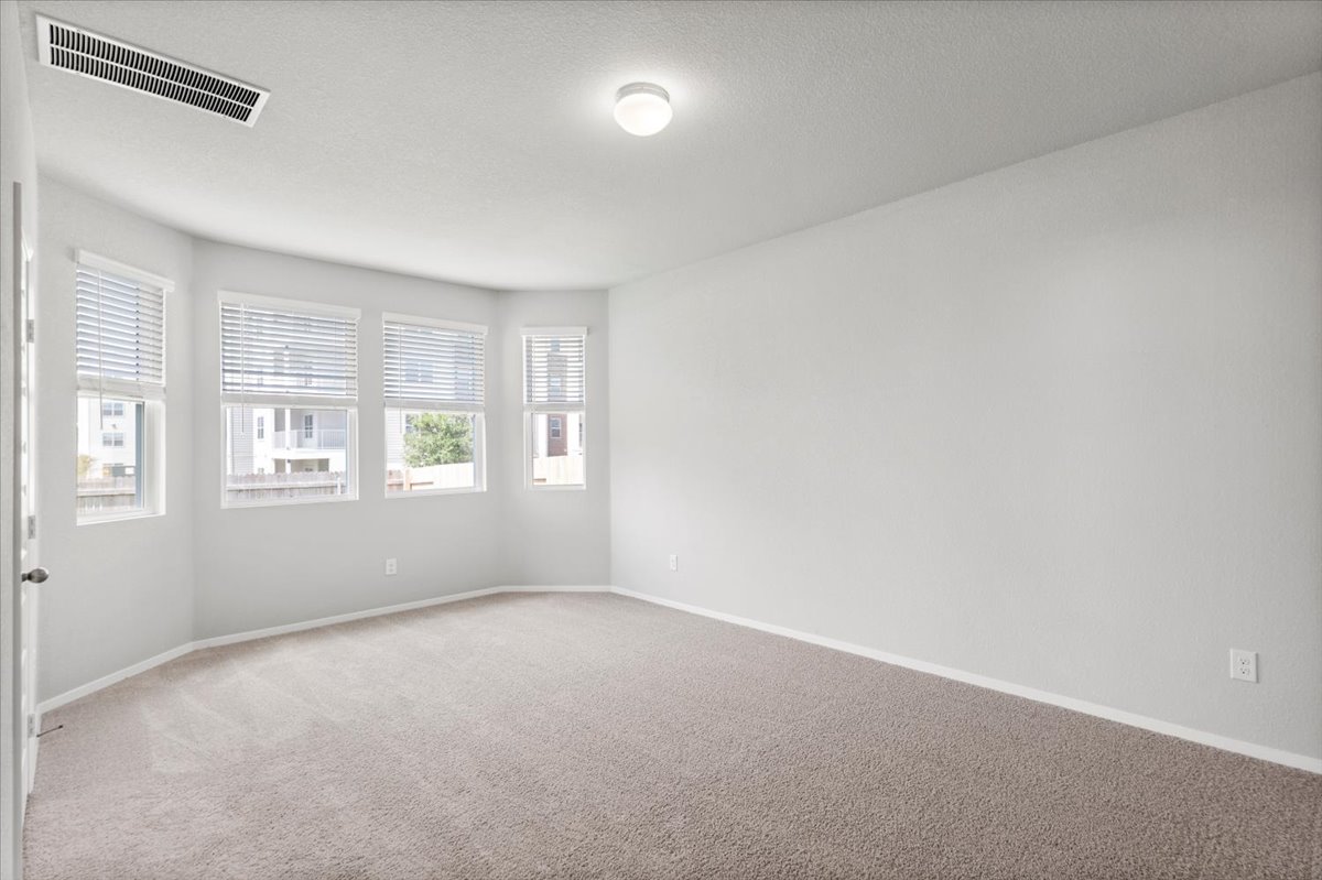 2607 Totley Road Manor, TX 78653 - Photo 15 of 40 Carpeted empty room featuring baseboards