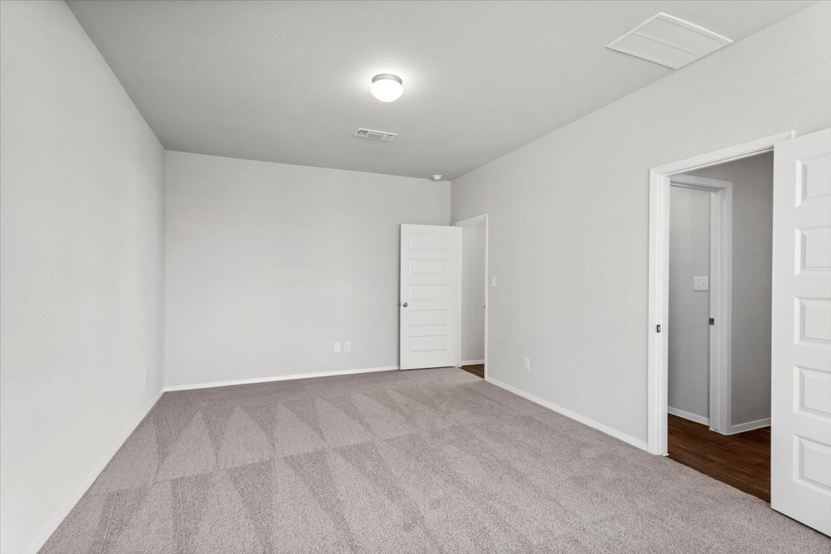 2607 Totley Road Manor, TX 78653 - Photo 16 of 40 Carpeted spare room with baseboards