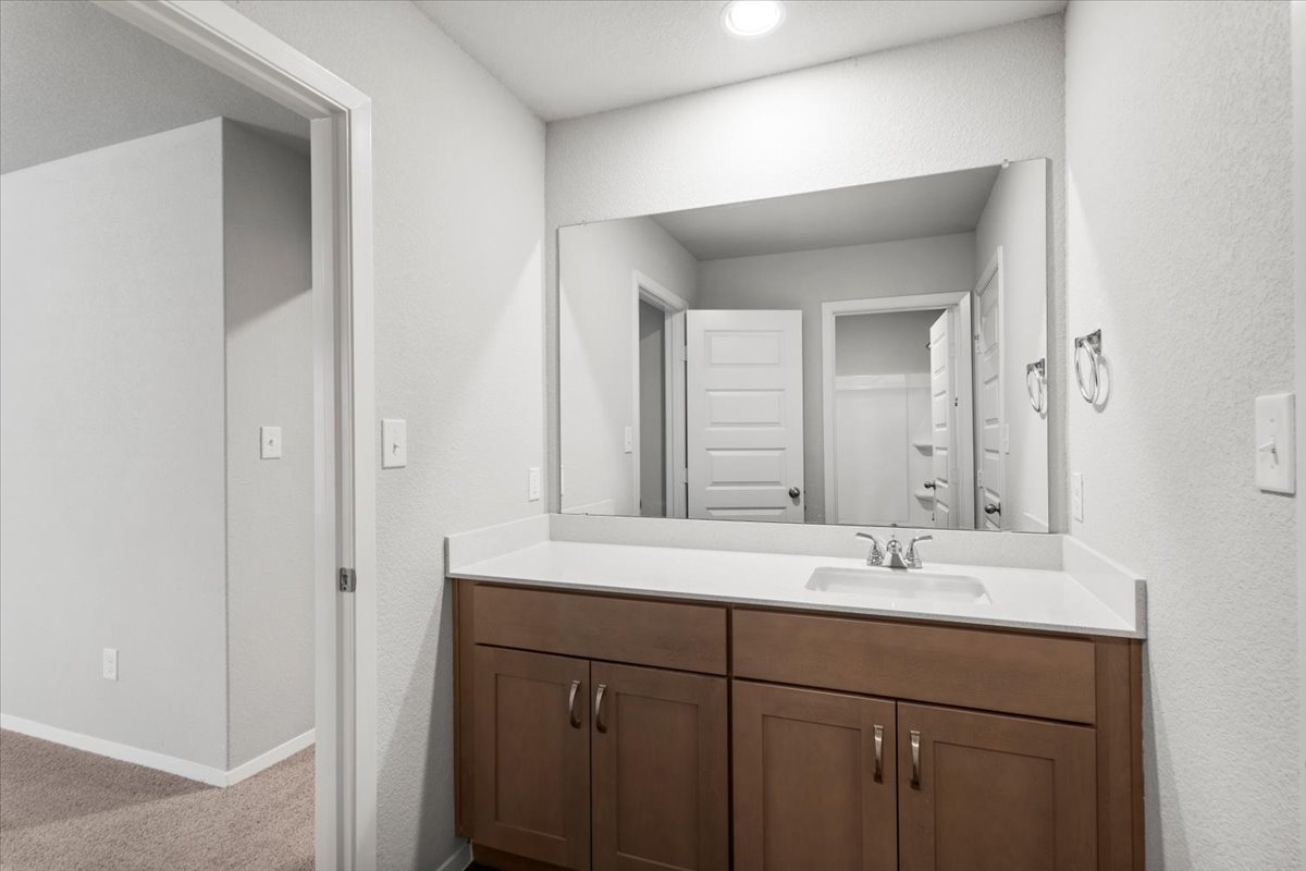 2607 Totley Road Manor, TX 78653 - Photo 25 of 40 Bathroom with vanity and recessed lighting