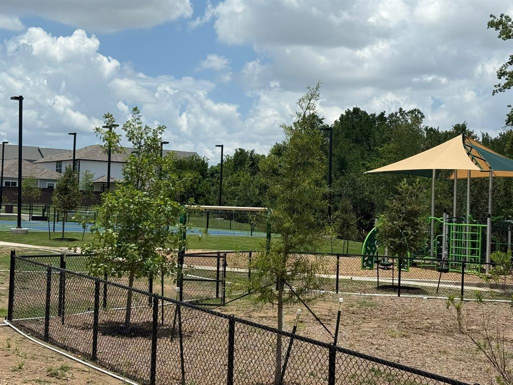 2607 Totley Road Manor, TX 78653 - Photo 38 of 40 View of property's community with a tennis court