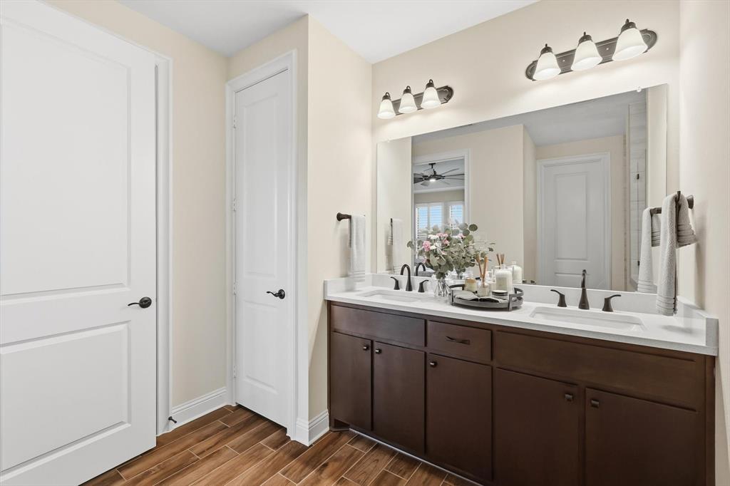 16912 Eastern Red Boulevard Justin, TX 76247 - Photo 13 of 22 a bathroom with a sink and mirror