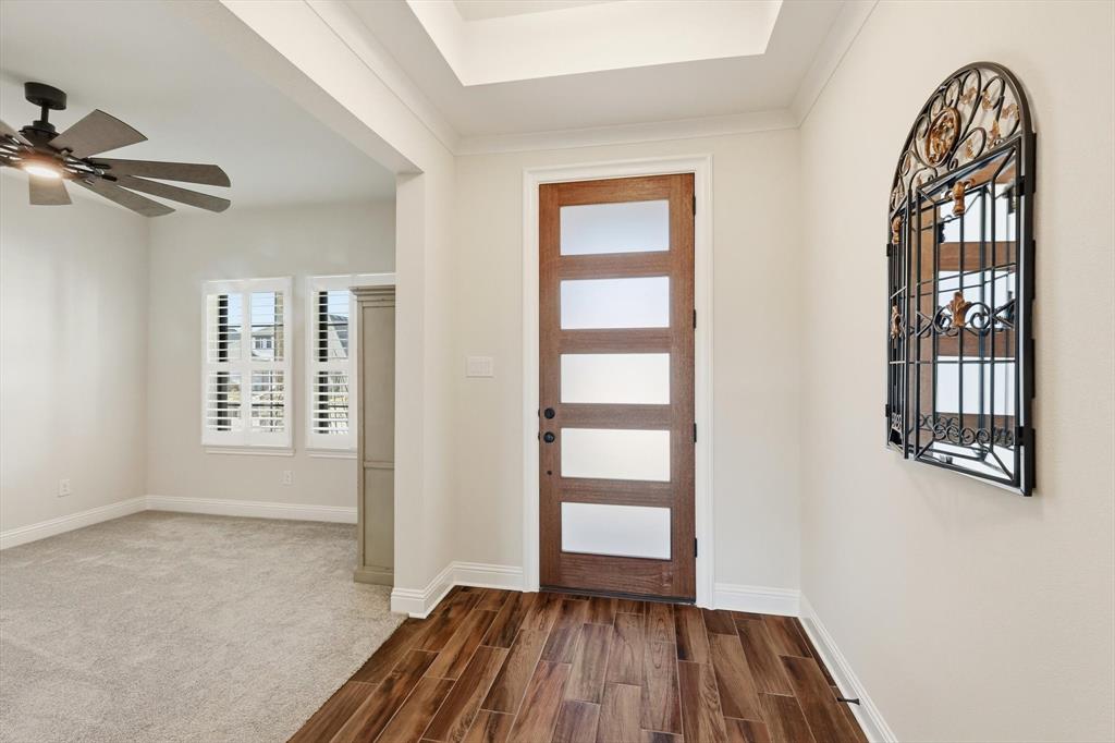 16912 Eastern Red Boulevard Justin, TX 76247 - Photo 4 of 22 wooden floor in an empty room with a window