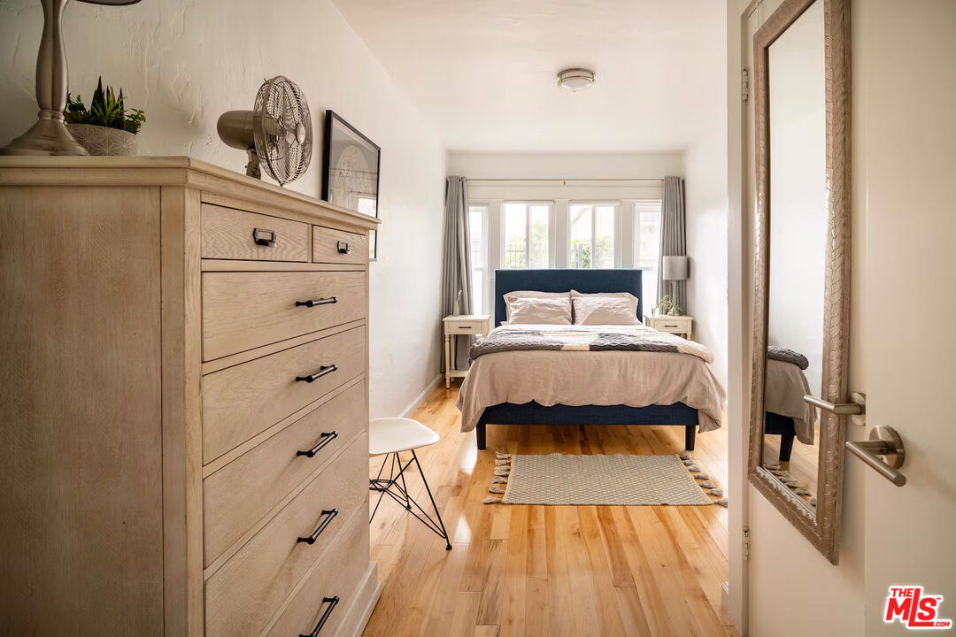 716 Sunset Avenue Venice, CA 90291 - Photo 6 of 13 a bedroom with a bed and a mirror