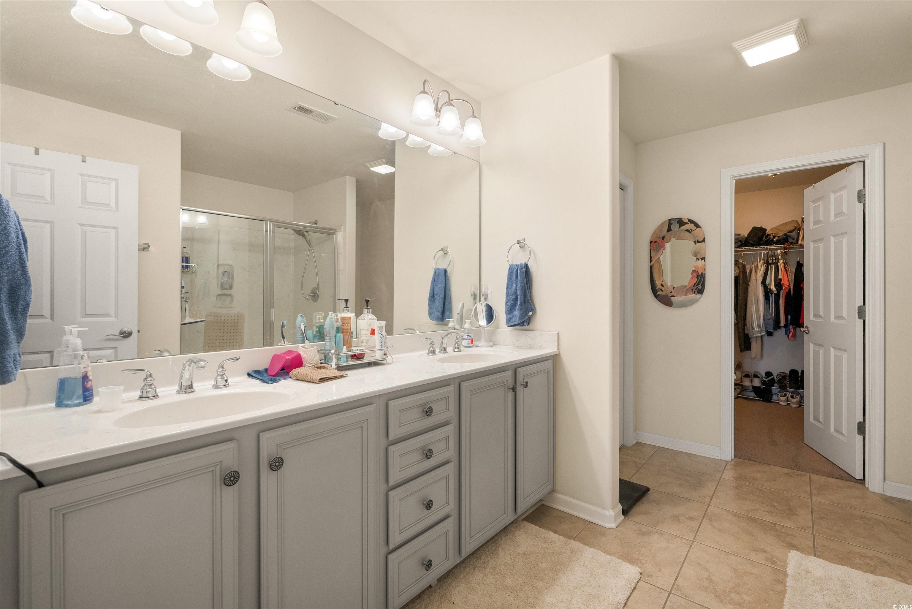 357 Southern Breezes Circle Murrells Inlet, SC 29576 - Photo 9 of 24 Full bath with a stall shower, double vanity, a sp