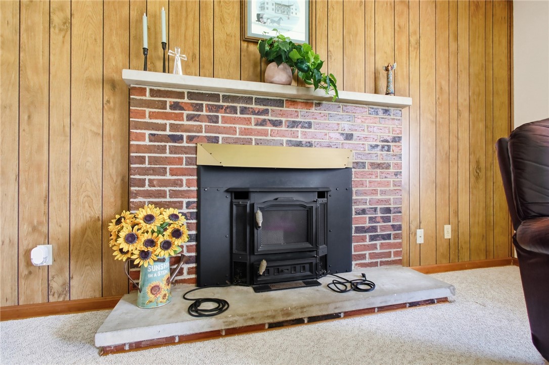6718 Old Columbus Road South Vienna, OH 45369 - Photo 7 of 33 This inviting living space features a cozy brick fireplace, perfect for warm gatherings.