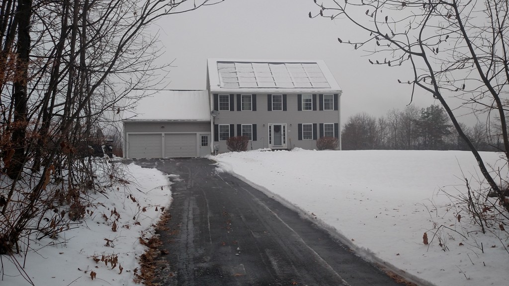 a view of a house with a snow