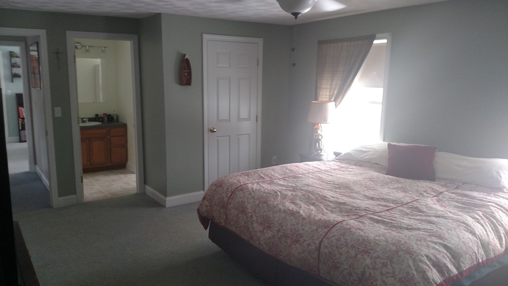 455 Hollis Road Lunenburg, MA 01462 - Photo 9 of 16 a bedroom with a bed and a window