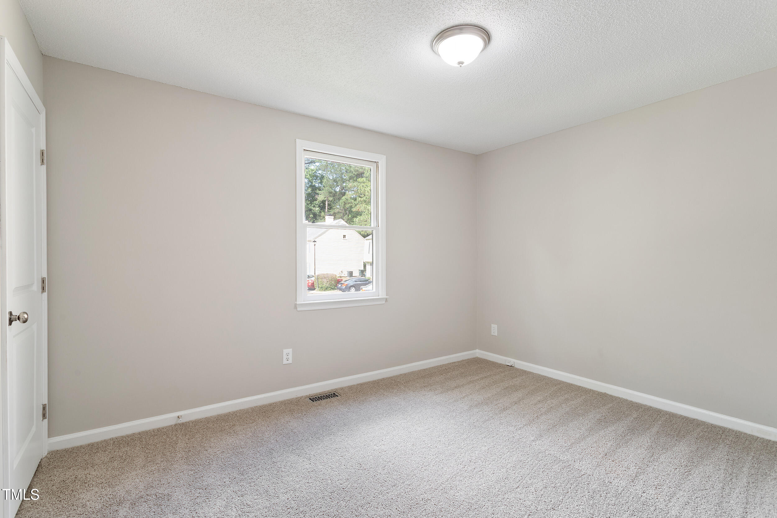 118 Rhum Place Garner, NC 27529 - Photo 18 of 26 an empty room with a window