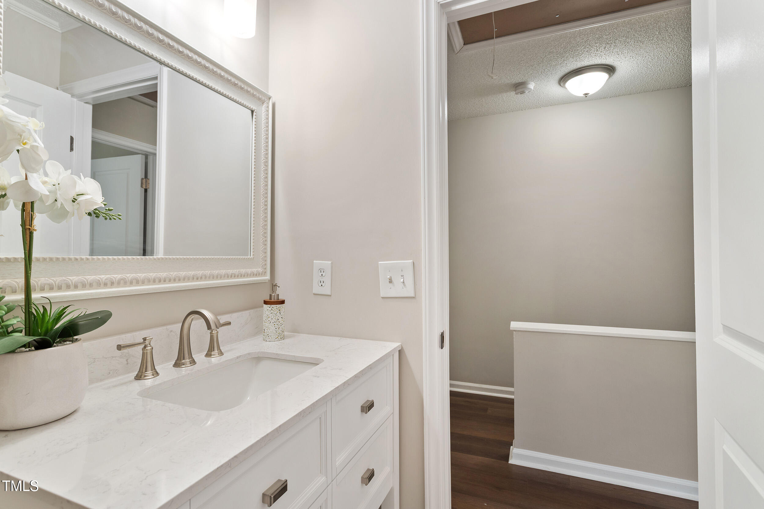 118 Rhum Place Garner, NC 27529 - Photo 21 of 26 a bathroom with a sink and a mirror