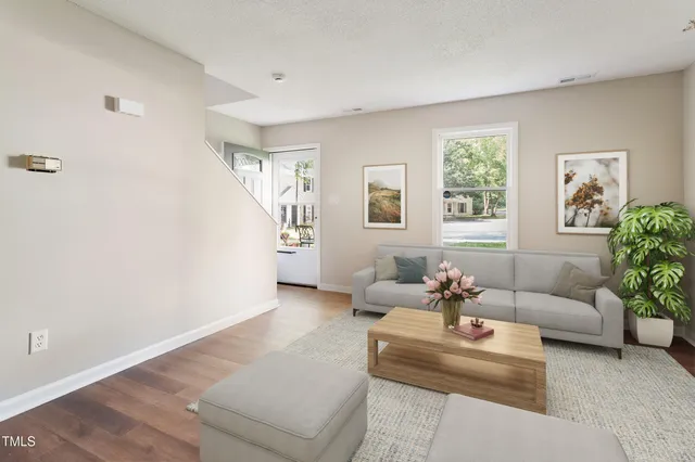 a living room with furniture and windows